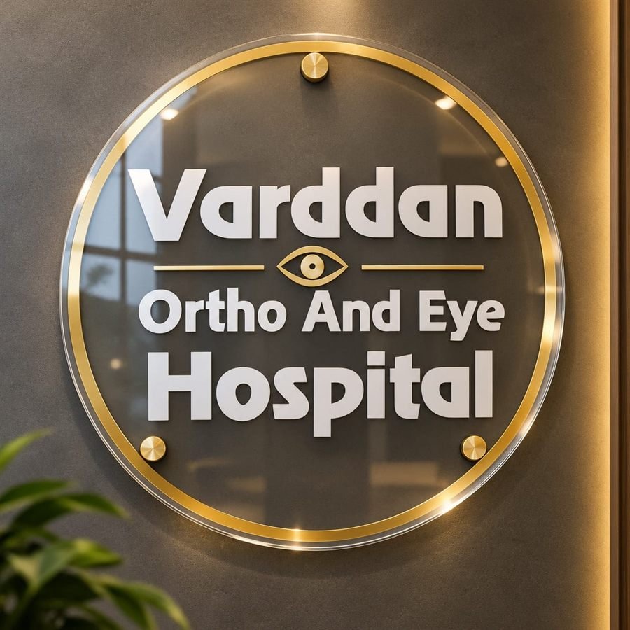 Clear acrylic hospital signage with a gold mirror rim and raised white lettering, mounted on gold standoff studs